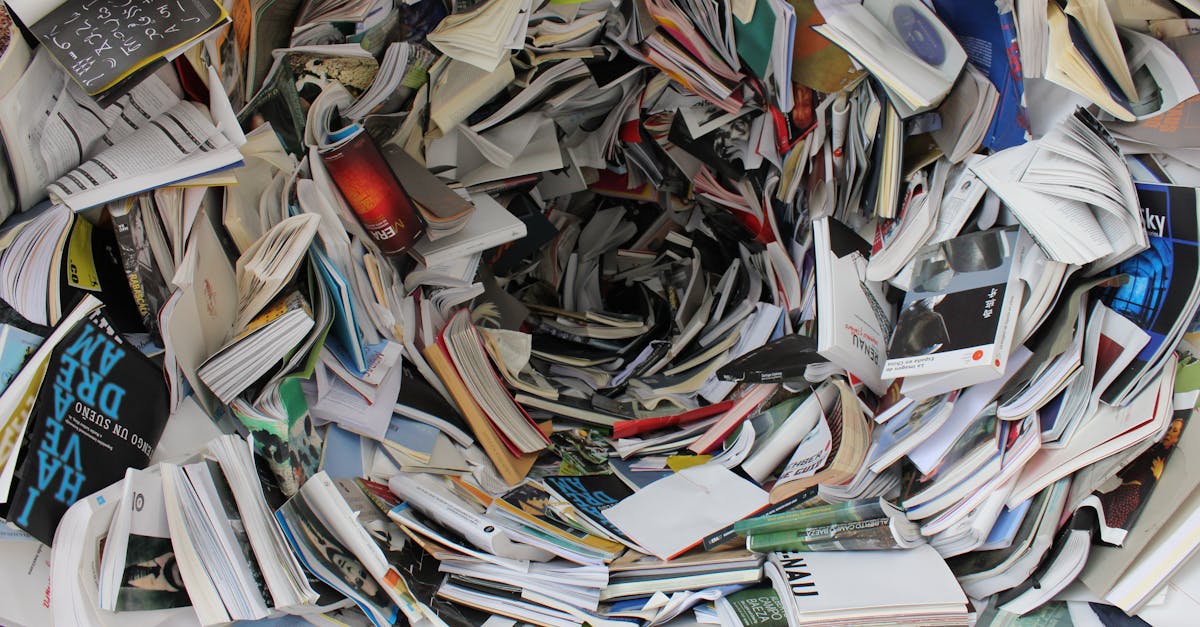 A whirlwind of books and papers creating a chaotic visual. Ideal for concepts of disorder or information overload.